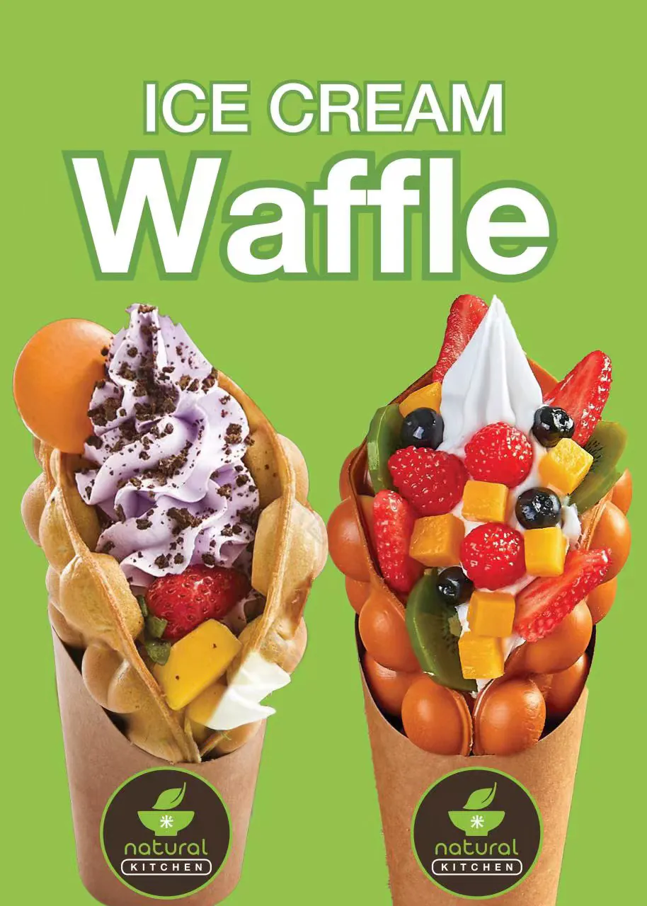 Two bubble waffle cones filled with ice cream, fruit, and toppings at Natural Kitchen Wilton, a Fast Casual Restaurant in Wilton