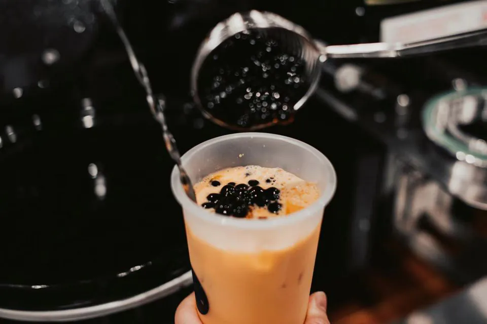 Adding tapioca pearls to bubble tea at Natural Kitchen Wilton, a Fast Casual Restaurant in Wilton